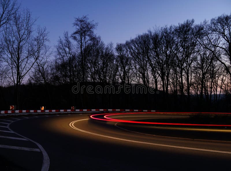 Long Exposure of Front and Rear Light Trails of a Moving Car on a