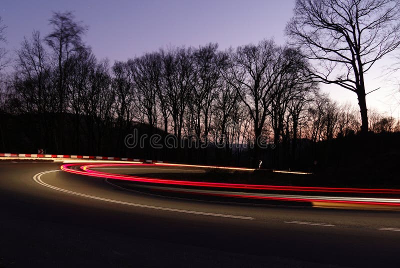 Long Exposure of Front and Rear Light Trails of a Moving Car on a