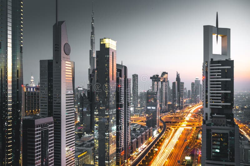Long Exposure View of Traffic and Skyline from Rooftop at Sunset Dubai