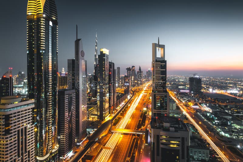 Long Exposure View of Traffic and Skyline from Rooftop at Sunset Dubai