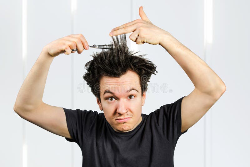 Long Hair Guy Shears Hair and Looks in Camera, on a White Background Stock Photo Image of