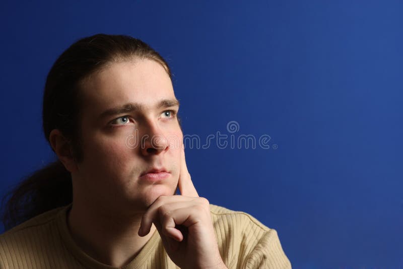 Long Hair Man Thinking and Looking To Right Upper Corner (place for