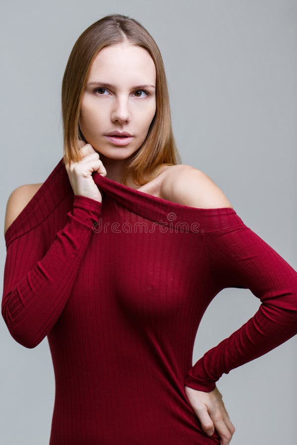 Long-haired girl in red dress royalty free stock image
