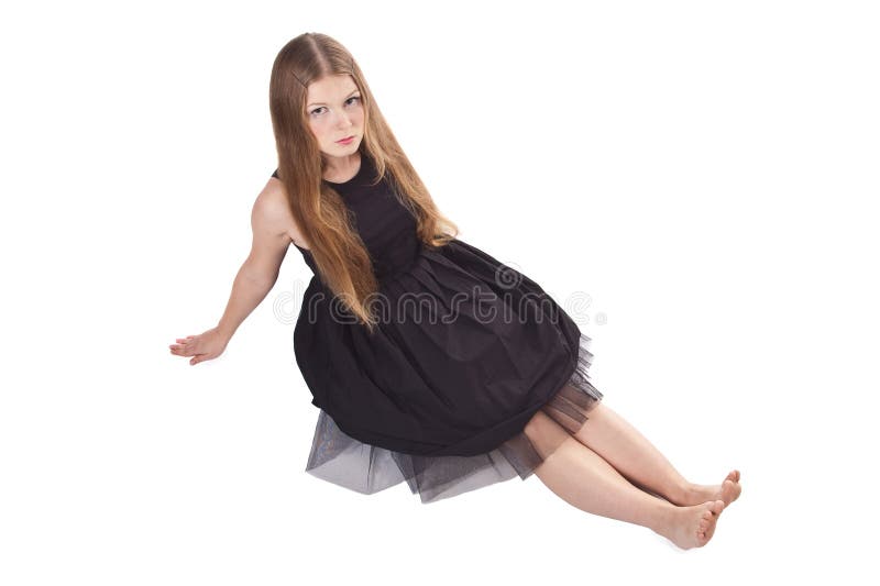 The long-haired girl sitting on the floor