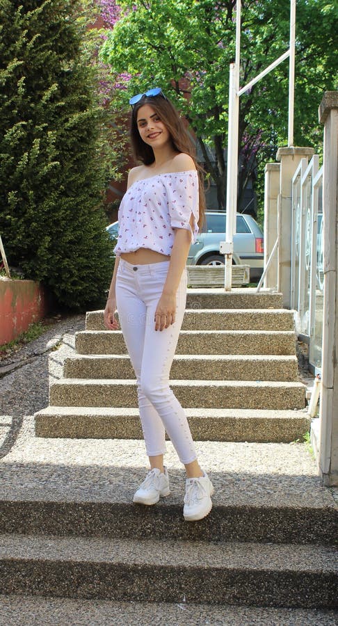 Genoptag molekyle vedhæng Long Haired Girl with White Pants Posing on the Stairs Stock Image - Image  of long, stairs: 181124915