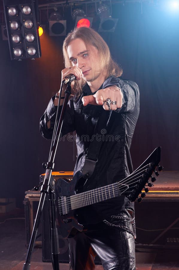 Long Haired Guitarist is Playing and Singing Stock Photo Image of