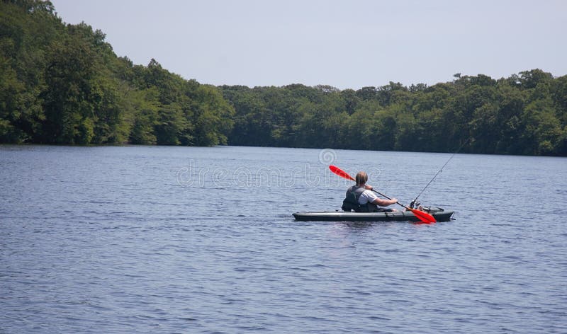 Long island new york fishing on kayak. There are numerous lakes in Long island for fishing ,but everybody should knows numerous regulations as well ,starting royalty free stock photography Long island new york fishing on kayak. There are numerous lakes in Long island for fishing ,but everybody should knows numerous regulations as well ,starting royalty free stock photography