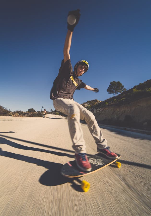 Long patineur de vitesse de tache floue de vitesse de pensionnaire de patineur image stock Long patineur de vitesse de tache floue de vitesse de pensionnaire de patineur image stock