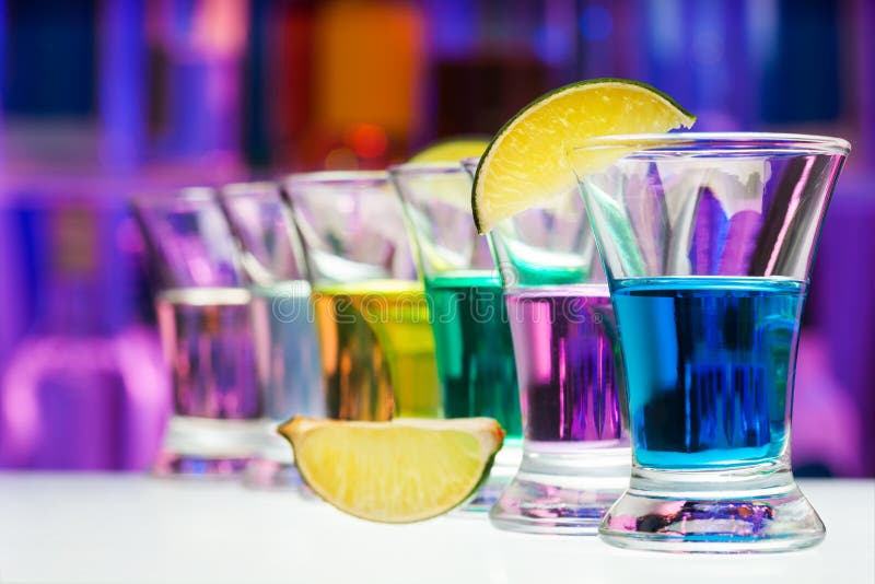 Long perspective row of shots with color drinks stock photography Long perspective row of shots with color drinks stock photography