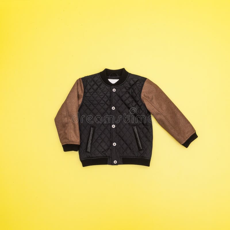Long sleeve jacket on yellow background royalty free stock photography Long sleeve jacket on yellow background royalty free stock photography