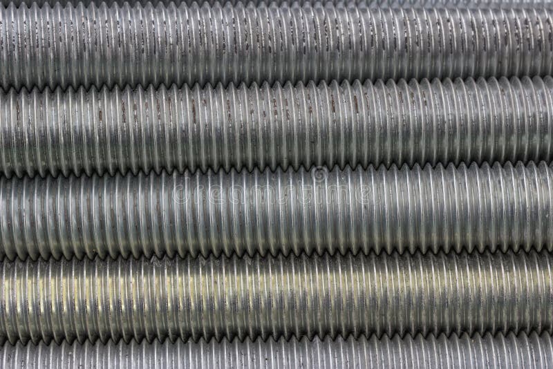 Close up of long steel screws thread background. Close up of long steel screws thread background