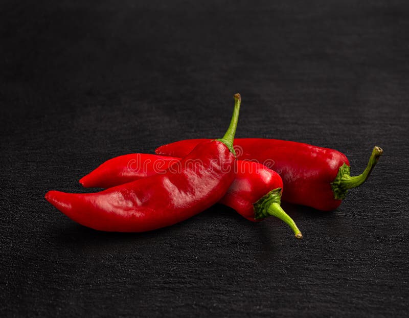 Long Sweet Green Pepper Cut in Half on Rustic Style Wood Background