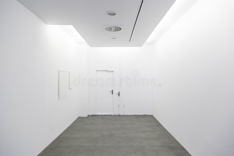 Long walkway and white wall