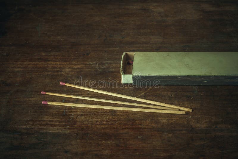 Long Wooden Matches for the Fireplace on a Wooden Table Stock Photo