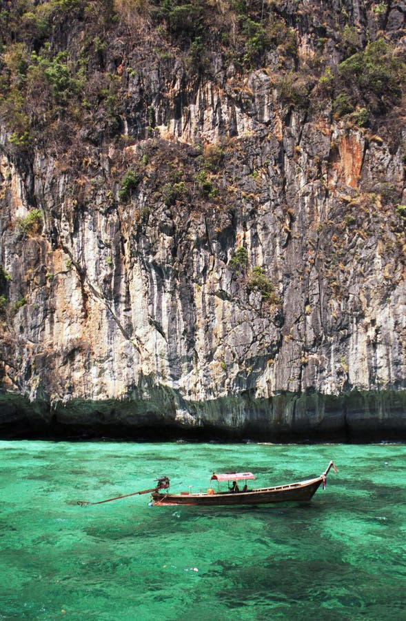 Longtail boat in turquoise waters