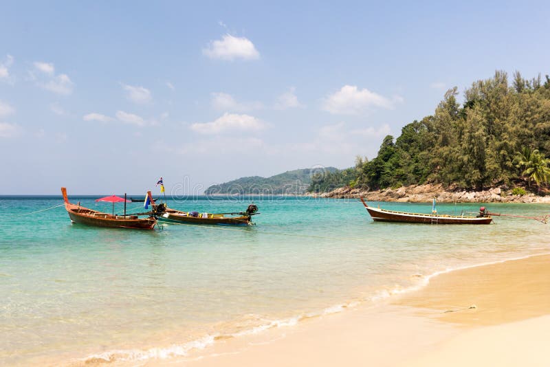 Longtail boats anchored at Banana beach, Phuket, Thailand stock photos Longtail boats anchored at Banana beach, Phuket, Thailand stock photos