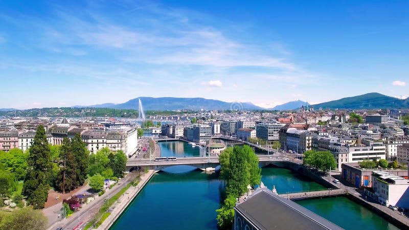 Longueur 4K aérienne de ville de Genève en Suisse - UHD banque de vidéos