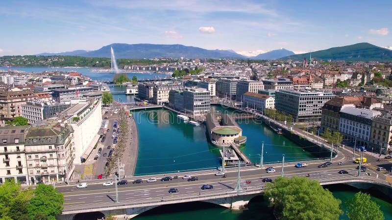 Longueur 4K aérienne de ville de Genève en Suisse - UHD banque de vidéos