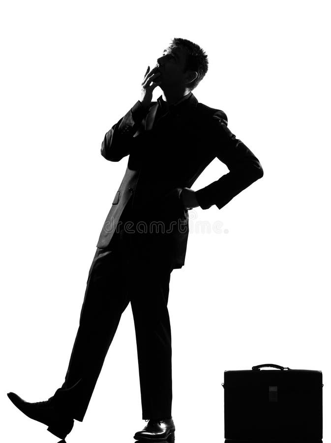 Silhouette caucasian business man thinking pensive behavior looiking up full length on studio isolated white background. Silhouette caucasian business man thinking pensive behavior looiking up full length on studio isolated white background