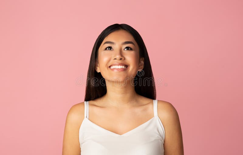 Look at it. Happy Asian Girl Looking Up, Pink Studio Background Stock Image  - Image of close, portrait: 170115239