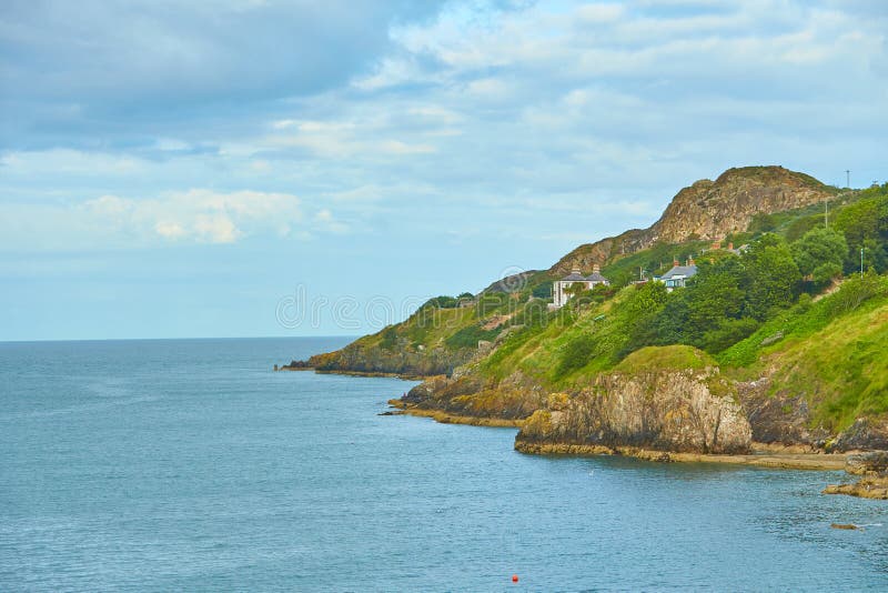 A Look on House in Cliff Dublin Bay on a Cloudy Sunny Day from Howth