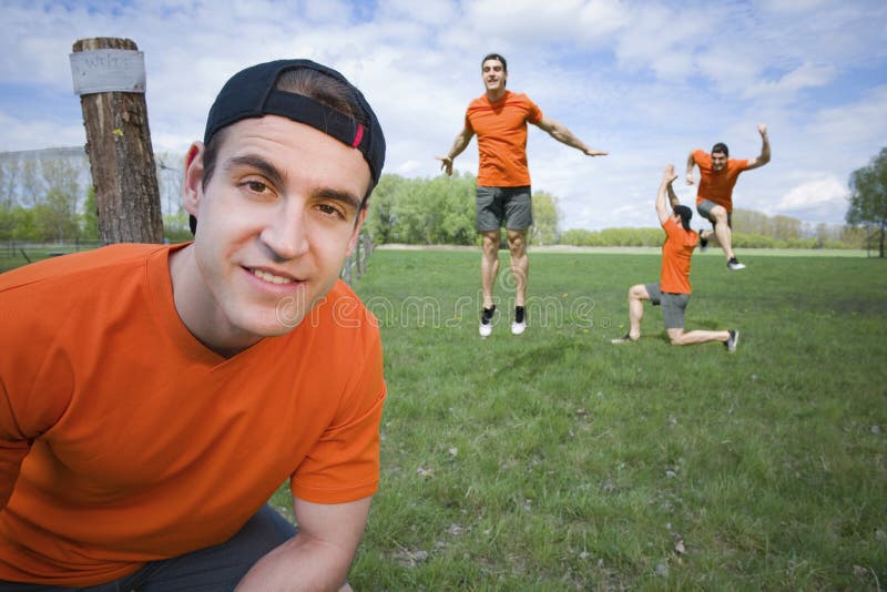 Composite: Wide angular near upper view of a young man in the Orange shirt ...