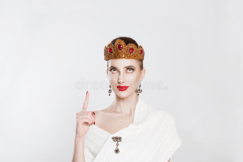 Look up here. Pretty cheerful woman gesturing with index finger and showing up one aha, i figured it out hand gesture royalty free stock image Look up here. Pretty cheerful woman gesturing with index finger and showing up one aha, i figured it out hand gesture royalty free stock image