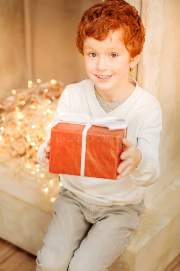 Excited Ginger Child Showing His Present Stock Photo Image of
