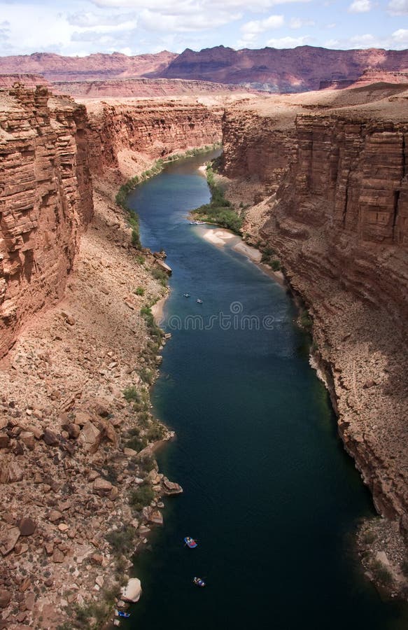 An aerial view from the Navajo Bridge of the Colorado River passing through the steep sided Marble Canyon in Arizona, America. An aerial view from the Navajo Bridge of the Colorado River passing through the steep sided Marble Canyon in Arizona, America.