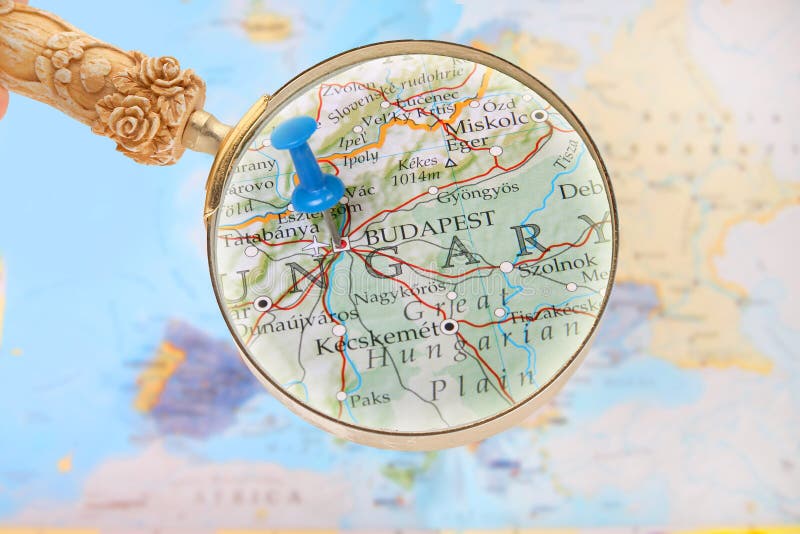 Looking in on Budapest, Hungary. Blue tack on map of Europe with magnifying glass looking in on Budapest, Hungary stock images Looking in on Budapest, Hungary. Blue tack on map of Europe with magnifying glass looking in on Budapest, Hungary stock images