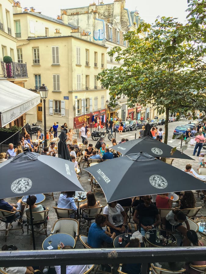 Looking down onto Montmartre cafe umbrellas on a summer afternoon, Paris, France stock photography Looking down onto Montmartre cafe umbrellas on a summer afternoon, Paris, France stock photography