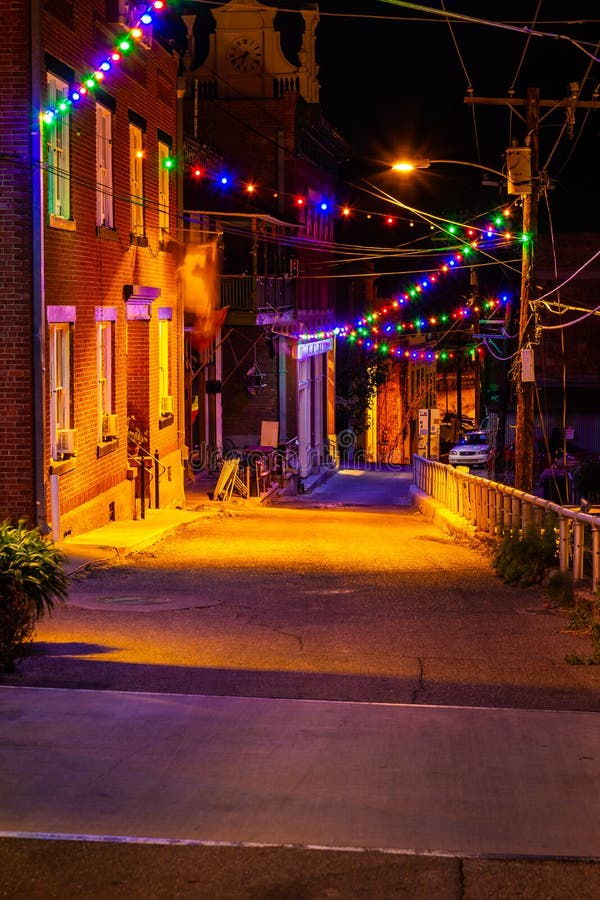 Looking Down a Smalltown Street with Christmas Lights Stock Image