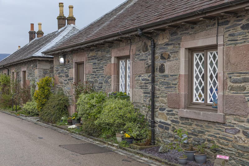 Looking down a street of small scottish houses stock photos