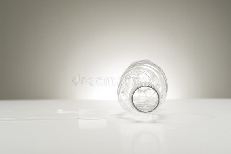 Looking into an empty water bottle stock images