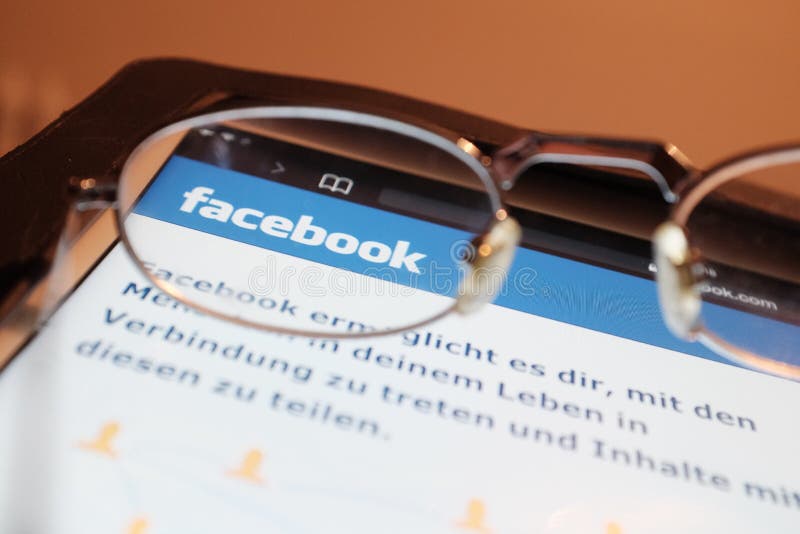 Looking at Facebook royalty free stock image