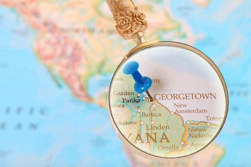 Looking in on Georgetown, Guyana. Blue tack on map with magnifying glass looking in on Georgetown, Guyana royalty free stock image Looking in on Georgetown, Guyana. Blue tack on map with magnifying glass looking in on Georgetown, Guyana royalty free stock image