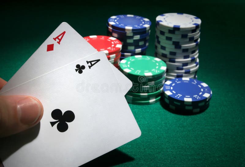 Looking at Pocket Aces during a Poker Game. Stock Photo Image of