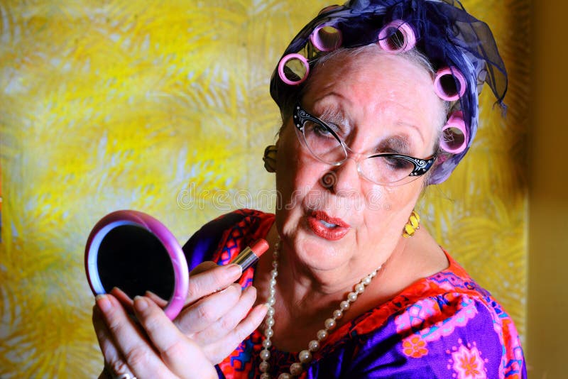 Silly gray haired granny lady wearing cat eye glasses, pearls and curlers i...