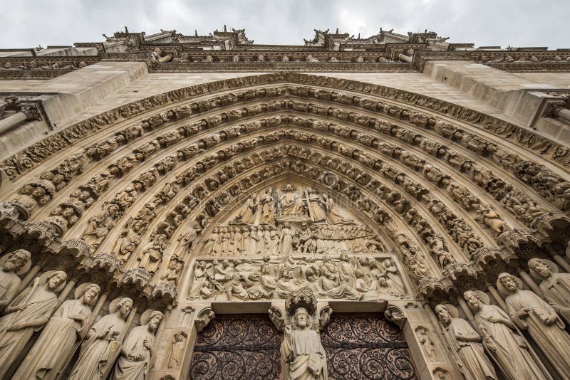 Looking up at the Gothic facade of Notre Dame de Paris Cathedral stock photography Looking up at the Gothic facade of Notre Dame de Paris Cathedral stock photography