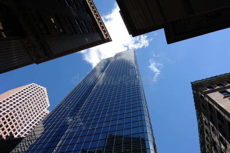 Looking up at the top of five skyscrapers