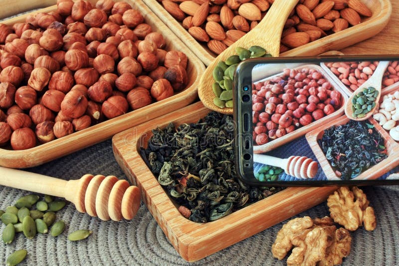 Leafy green tea and nuts stock image. Image of mixed 242751725