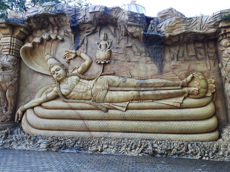 Vishnu sleeping on snake hi-res stock photography and images - Alamy