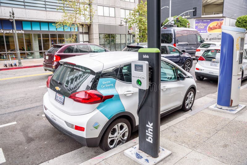 electric-cars-for-sharing-parked-along-a-street-in-los-angeles-downtown