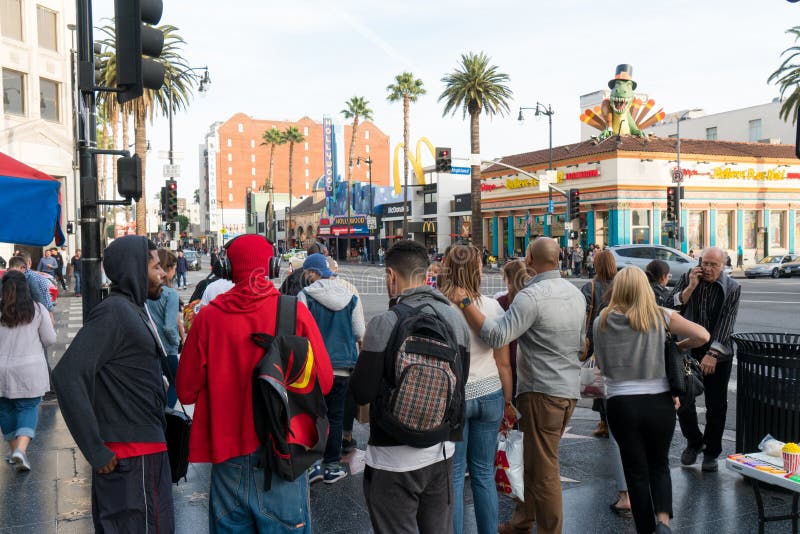 Los Angeles, California, USA 12, 2017: Local people waiting for traffic light to across the street at intersection near the Hollyw