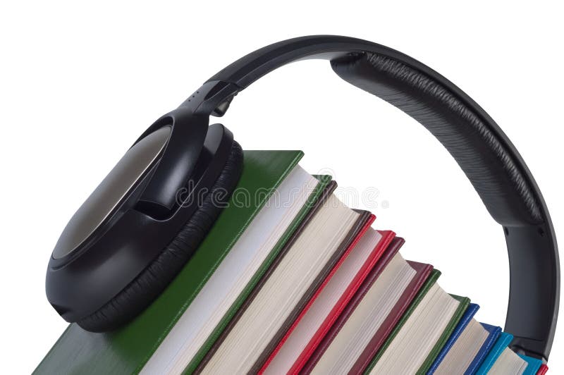 Los auriculares en los libros se cierran para arriba. fotos de archivo Los auriculares en los libros se cierran para arriba. fotos de archivo