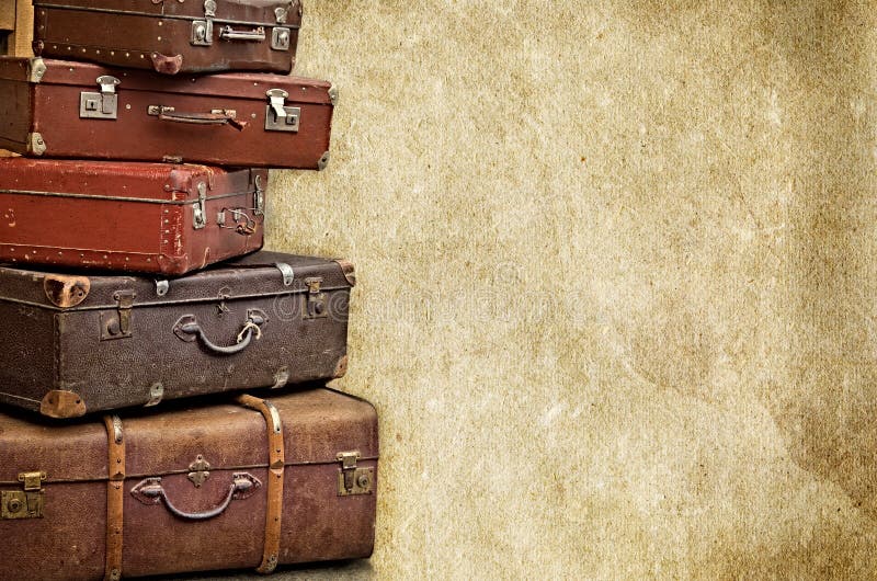 Los bolsos retros en el viejo vintage texturizaron el fondo de papel imágenes de archivo libres de regalías