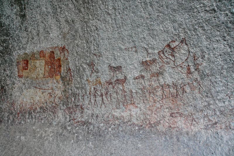 Los bosquimanos oscilan la pintura de las figuras y de los antílopes humanos, jirafa del parque nacional de Matopos, Zimbabwe imagen de archivo libre de regalías Los bosquimanos oscilan la pintura de las figuras y de los antílopes humanos, jirafa del parque nacional de Matopos, Zimbabwe imagen de archivo libre de regalías