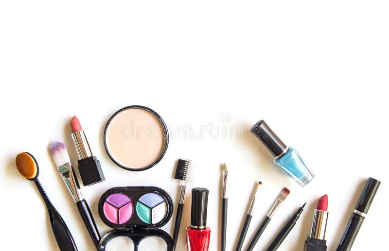 Cosmetics and fashion background with make up artist objects: lipstick, eye shadows, mascara ,eyeliner, concealer, nail polish. Lifestyle Concept. Cosmetics and fashion background with make up artist objects: lipstick, eye shadows, mascara ,eyeliner, concealer, nail polish. Lifestyle Concept