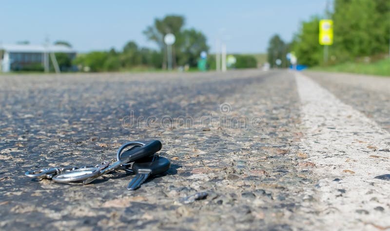 Lost a bunch of keys lying on the asphalt surface royalty free stock images