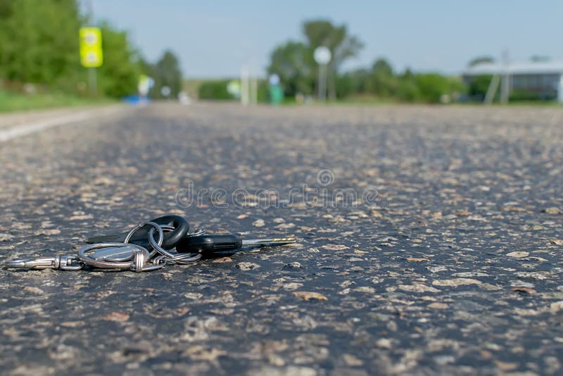 Lost a bunch of keys lying on the asphalt royalty free stock images